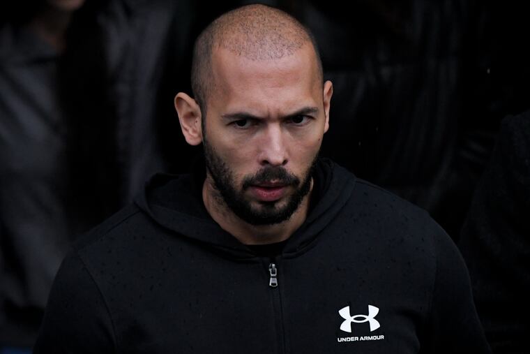 Andrew Tate leaves the Court of Appeal, in Bucharest, Romania, Tuesday, Jan .10, 2023. Andrew Tate, a divisive social media personality and former professional kickboxer, was detained last month in Romania.