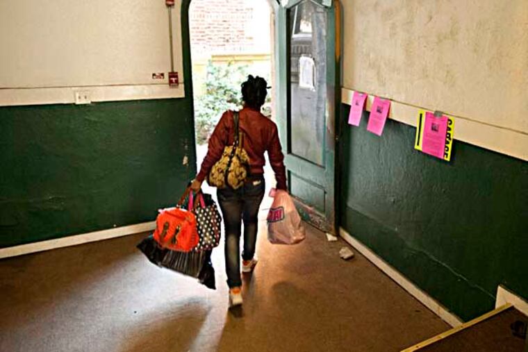 A resident of the Oak Lane Garden condominiums, 6751 N. 13th St. moves out after L&I evicted residents citing unsafe condtions through out the building. ( RON TARVER / Staff Photographer ) March 14 2014