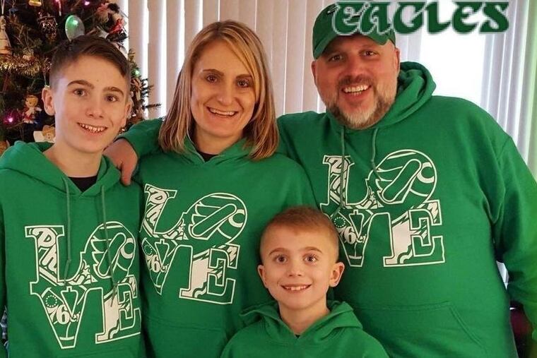 Christmas 2017 photo of the Flannery family (from left): James, Alicia, George, Jim