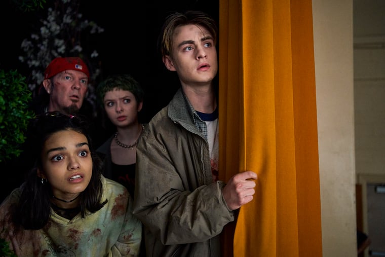 From left: Rachel Zegler, Fred Durst, Lachlan Watson, and Jaeden Martell in Kyle Mooney's horror-comedy "Y2K." Martell, a Philly native, moved with his family to L.A. when he was 8.