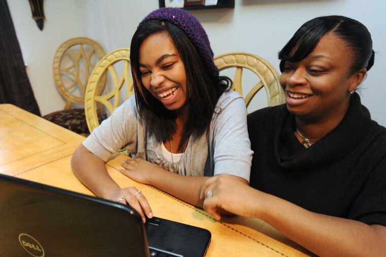 At their Marlton home, Nala Bailey, 14, with her mother, Nicole. Nala says TechGirlz has boosted her confidence.