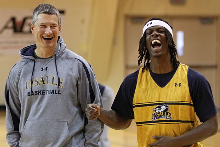 La Salle head coach Dr. John Giannini (left) shares a funny moment from a game with Tyrone Garland. (Michael Bryant/Staff Photographer)
