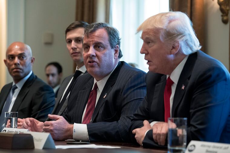 President Donald J. Trump, right, listens as then-New Jersey Gov. Chris Christie, middle, delivers remarks at the White House in March 2017.