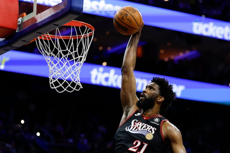Joel Embiid goes up for a dunk that aided the Sixers center's team-high 38-point performance in Saturday's narrow 112-109 loss to the New York Knicks at Xfinity Mobile Arena.