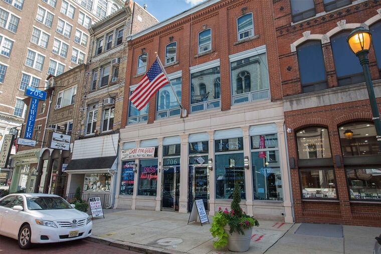 Five properties in the 700 block of Sansom Street would be demolished for a 16-story residential tower under the plan.