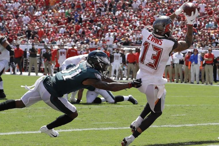 Mike Evans of Tampa Bay pulls in a touchdown pass after beating Eagles cornerback Jalen Mills.