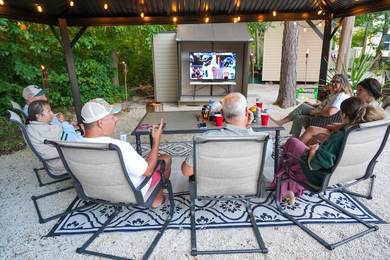 Friends and family watch the first Eagles preseason game at the summer home of Cori Laphan, Jon Morad, and Lisa Laphan-Morad in Cape May Court House.