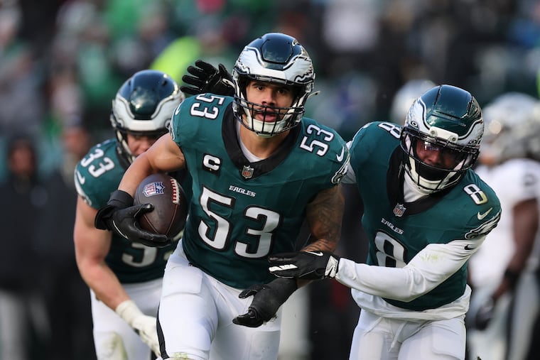 Eagles linebacker Zack Baun celebrates his third-quarter interception with cornerback Adoree' Jackson (8) in Sunday's win over the Raiders.