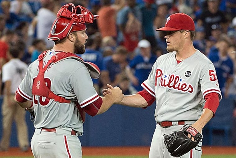 Philadelphia Phillies catcher Cameron Rupp (29) and Philadelphia Phillies relief pitcher Ken Giles (53) celebrate their win after a game against the Toronto Blue Jays at Rogers Centre. The Philadelphia Phillies won 3-2. (Nick Turchiaro/USA Today)