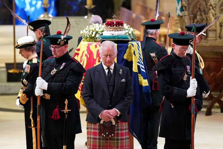 Britain's King Charles III (center) and other members of the royal family holding a vigil at the coffin of Queen Elizabeth II at St. Giles' Cathedral in Edinburgh, Scotland on Monday.