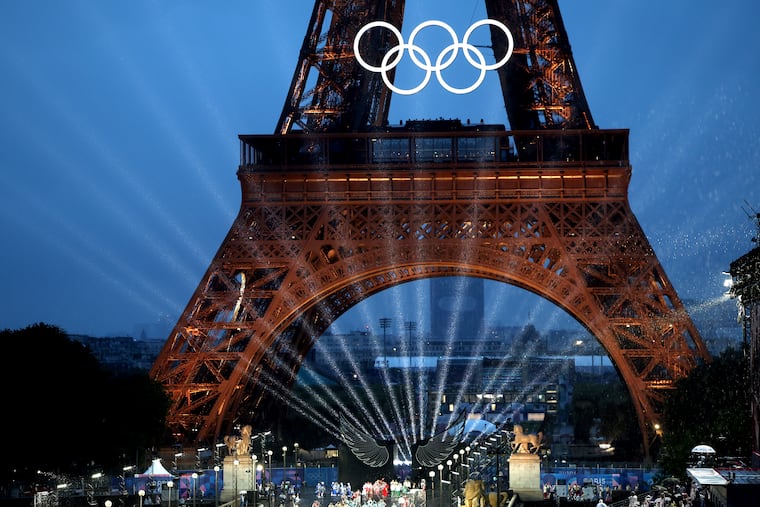 Lights shine under the Eiffel Tower, in Paris during the opening ceremony of the 2024 Summer Olympics.