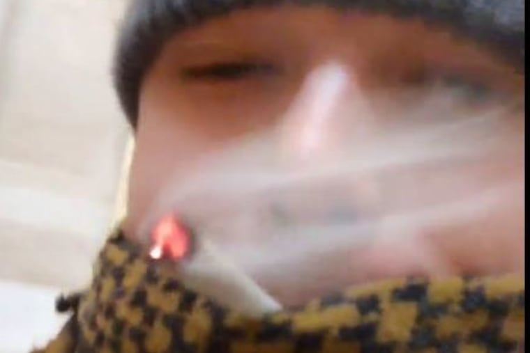 A still from footage James Douglas "JD" Rahm III filmed on Jan. 6, 2021, appears to show him smoking a joint in the Rotunda of the U.S. Capitol building in Washington, federal prosecutors said.