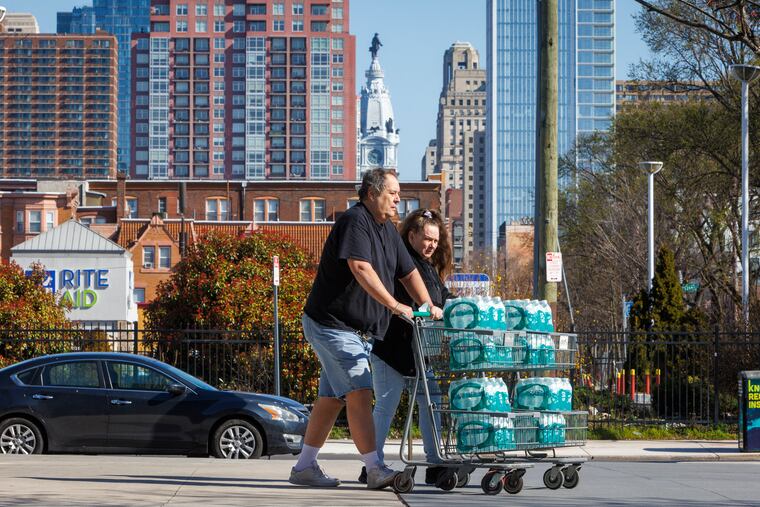 Customers buy water at Sprouts at South Broad and Carpenter in Philadelphia after a shipment arrived Monday morning.