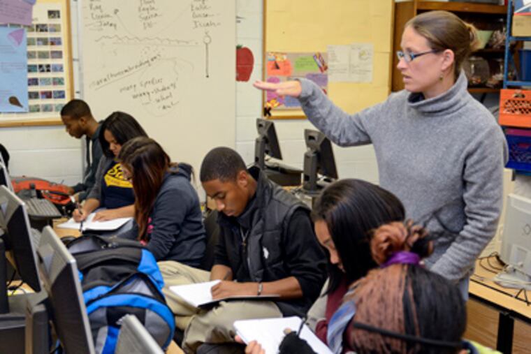 Teacher Jessica McAtamney in class at W.B. Saul. She was honored at the White House for her work, and student Isaiah Nelson (center) is headed to a national science fair after a state win. TOM GRALISH / Staff Photographer
