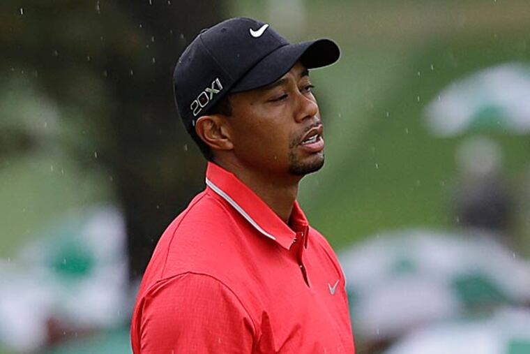 You could say the 2-stroke penalty assessed Saturday morning to Tiger Woods kept him from making a serious charge at the leaders on Sunday in the Masters. (David J. Phillip/AP)
