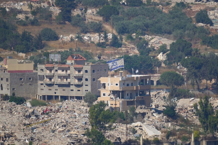 An Israeli flag tops a destroyed building in southern Lebanon, as seen from northern Israel, Sunday, June 28, 2026.