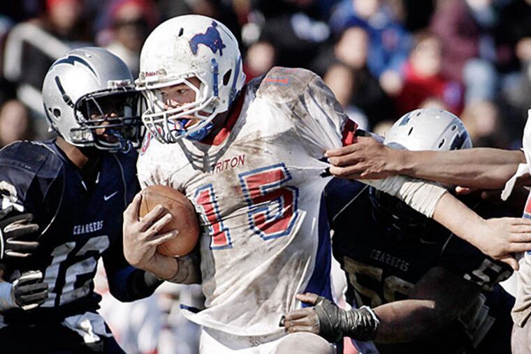Triton's quarterback # 15 Brian Keller runs the ball during the Triton at Timber Creek H.S. football game on November 24, 2011.