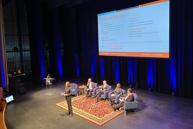 The Chamber of Commerce for Greater Philadelphia hosts its annual outlook event on Dec. 20, 2023, at the Kimmel Center for the Performing Arts in the Perelman Theater. Sitting on stage (from left) Roc Armenter, executive vice president, economist, and director of research of the Consumer Finance Institute, Federal Reserve Bank of Philadelphia; John Fry, president, Drexel University; Jodie Harris, president, PIDC; Kathryn Ott Lovell, president and CEO, Philadelphia Visitor Center Corp. Standing is moderator Tracey Matisak.