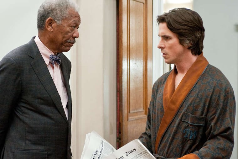 Father figure: Morgan Freeman as Lucius Fox and Christian Bale as Bruce Wayne in "The Dark Knight Rises."
