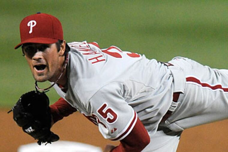 Cole Hamels allowed just one run on five hits in eight strong innings against the Nationals. (Richard Lipski/AP)