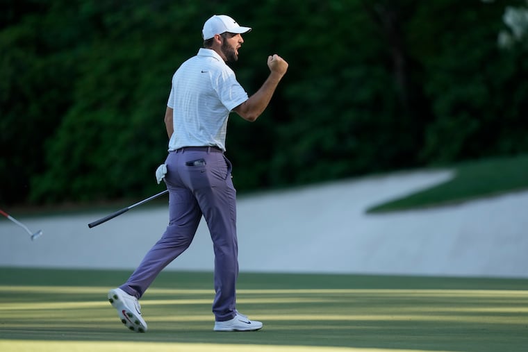 Scottie Scheffler celebrates after an eagle on the 13th hole during third round at the Masters golf tournament on April 13.