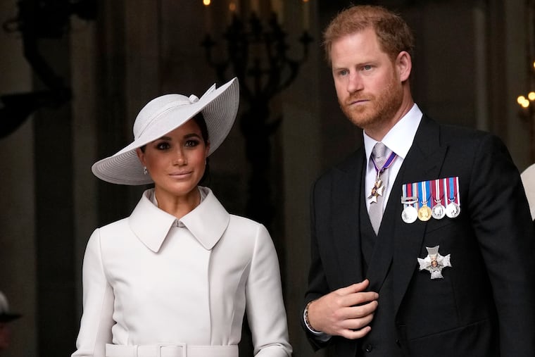 Prince Harry and Meghan Markle, Duke and Duchess of Sussex leave after a service of thanksgiving for the reign of Queen Elizabeth II at St Paul's Cathedral in London, on Friday.