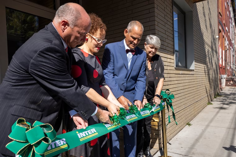 Jose R. Muñoz Avila (from left), board president of Inter American University Puerto Rico; Nasheli Ortiz Gonzalez, executive director of Taller Puertoriqueño; Rafael Ramirez Rivera, acting president of Inter America University Puerto Rico; and Elena DiLapi, president of the board of directors of Taller Puertroriqueño, cutting the ribbon to open the new Inter Philadelphia Education Center at Taller Puertoriqueño.
