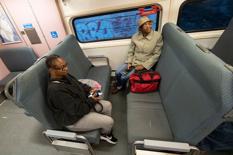 Sisters Jacqueline Robinson (left) and Florence Walker, ride NJ Transit train No. 7861 from 30th Street Station to Atlantic City on Sunday morning. Mother's Day was the first day of restored service on the Atlantic City line.
