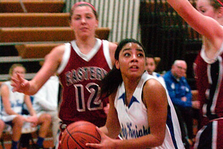 Sterling's Anyssa Sanchez goes up to score over Eastern's Amy Solinski. Sterling won 45-28. (Ron Tarver / Staff Photographer)