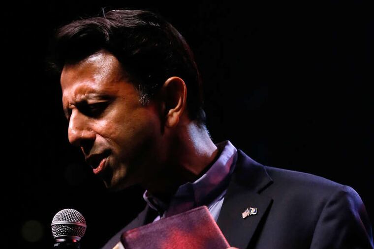 Gov. Bobby Jindal , said to be weighing a presidential run, addresses the Baton Rouge rally, which also drew protesters. AP