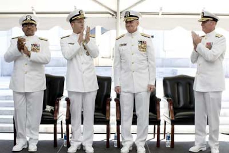 Vice Adm. Adam Robinson (left); Chief of Naval Operations Adm. Mike Mullen; and Rear Adm. Richard Jefferies, commander of National Naval Medical Center, applaud Vice Adm. Donald C. Arthur, Surgeon General and chief of the Bureau of Medicine and Surgery, at the change of office and retirement ceremony for Arthur. (U.S. Navy photo by Chad J. McNeeley)