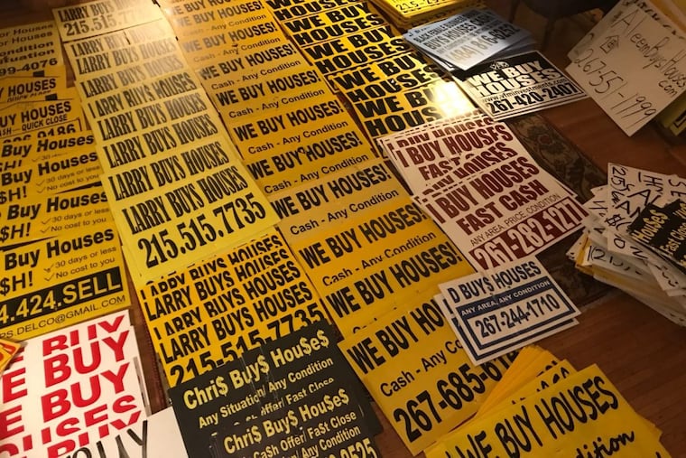 Some of the 228 signs collected by Michael Froehlich over the weekend after he offered $1 per sign to neighbors. The signs yielded about 60 unique numbers which we called Tuesday.