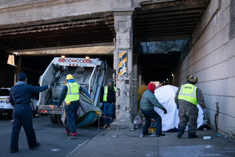 City workers clear tents and other debris from the Emerald Street encampment in Kensington, Philadelphia, January 31, 2019. JESSICA GRIFFIN / Staff Photographer