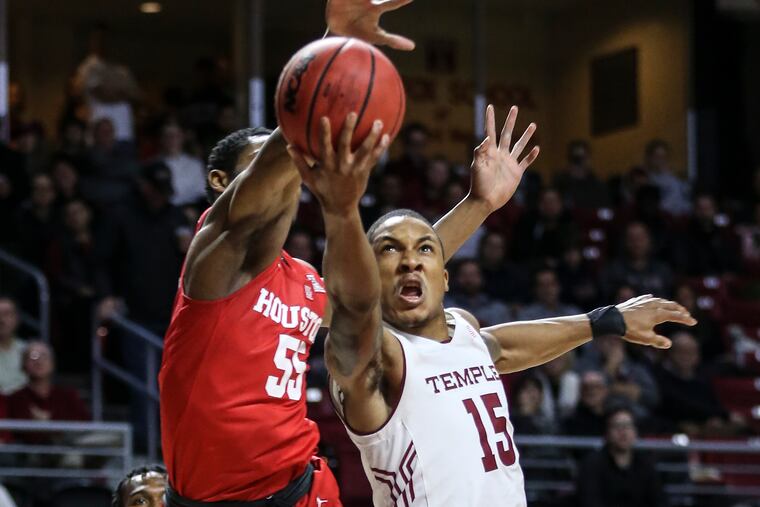 Temple's Nate Pierre-Louis goes up for a shot under Houston's Brison Gresham during the 1st half at The Liacouras Center in Philadelphia Friday, January 9, 2019. STEVEN M. FALK / Staff Photographer