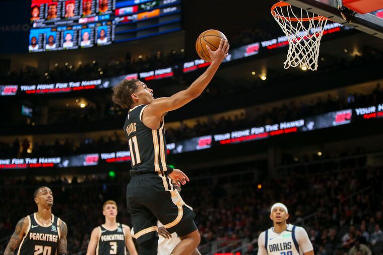 Atlanta Hawks guard Trae Young (11) scoring against the Dallas Mavericks on Saturday.