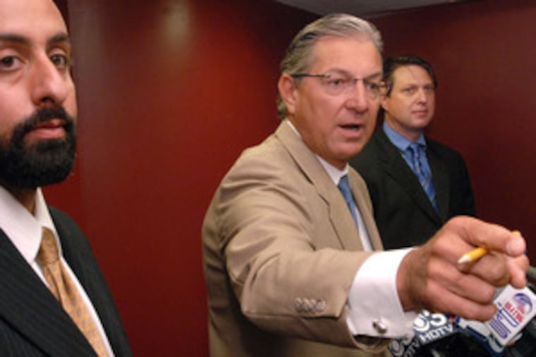 Attorneys Brian Mildenberg (left) and Eric Zajac flank Mildenburg's attorney, George Bochetto, at a news conference during which Bochetto defended the propriety of the civil lawsuit Mildenberg and Zajac filed on behalf of Danieal Kelly's estate.