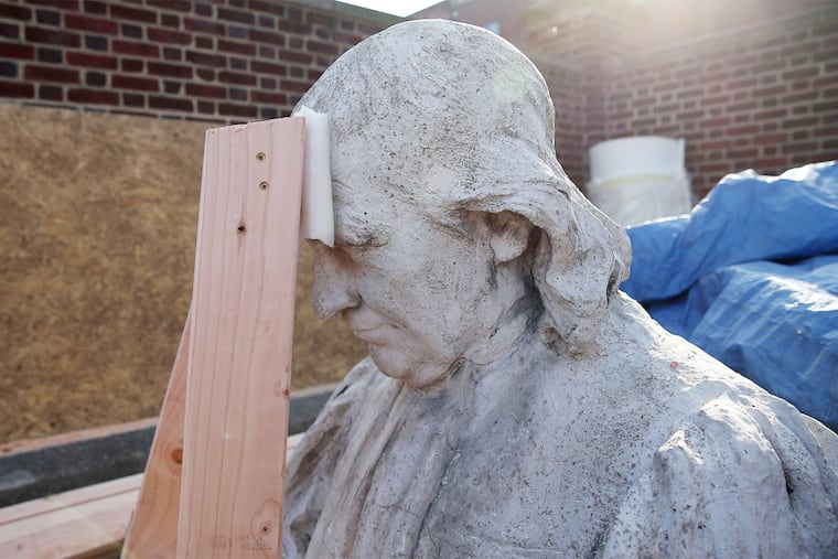 A bust of John Witherspoon is readied for conservation. The statues were made for the Witherspoon Building at Walnut and Juniper Streets.
