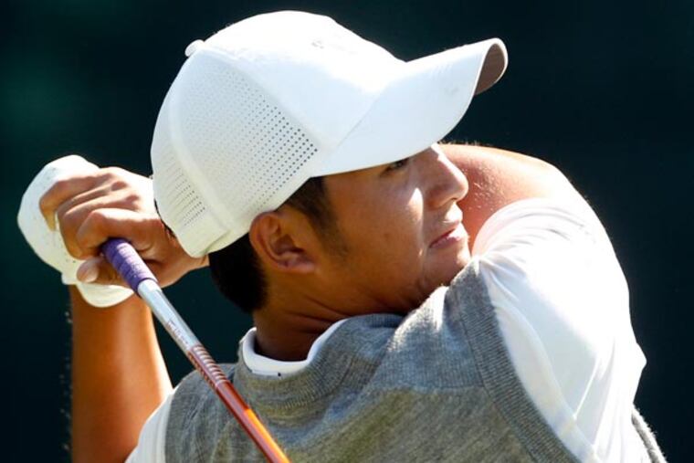 Cheng-Tsung Pan watches his shot on the 18th tee during the completion
of the second round of the 2013 U.S. Open at the Merion Golf Club on
Saturday, June 15, 2013. (Yong Kim/Staff Photographer)