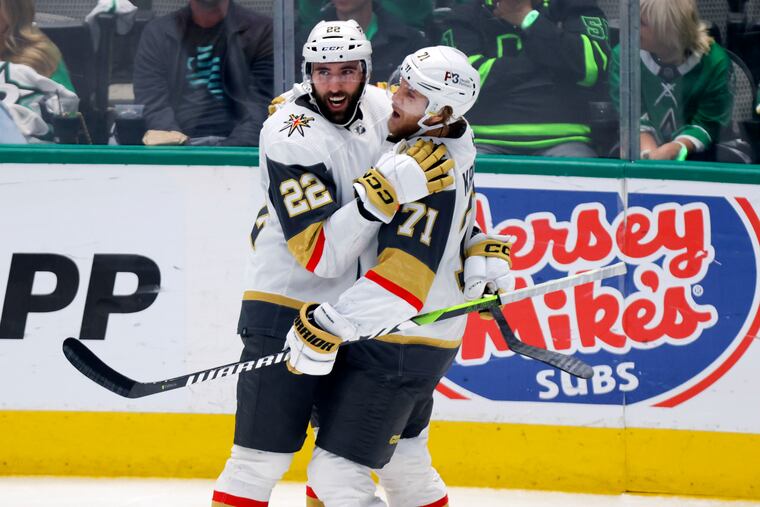 Vegas Golden Knights center William Karlsson (71) celebrates with right wing Michael Amadio (22) after Karlsson's goal during the third period.