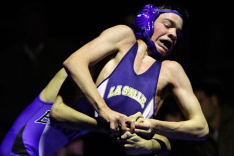 LaSalle's Tim Walker breaks away from Conwell-Egan's Kyle Ranochak in the 130 weight class. (Laurence Kesterson/Staff Photographer)