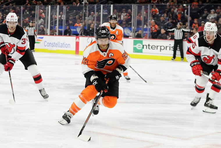 Flyers captain Claude Giroux (center) and the NHL could be playing games again as early as Jan. 13.