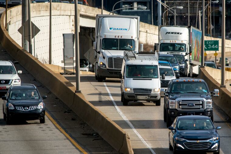 Coming off two lanes on I-676, the Vine Street Expressway, trucks and cars merge into a single lane as they enter westbound I-76, the Schuylkill Expressway Mar. 4. The interchange is the 26th biggest choke point for trucks on U.S. highways and freeways, according to the American Traffic Research Institute. It is the worst of five Philadelphia area bottlenecks that made the annual list of 100 worst.