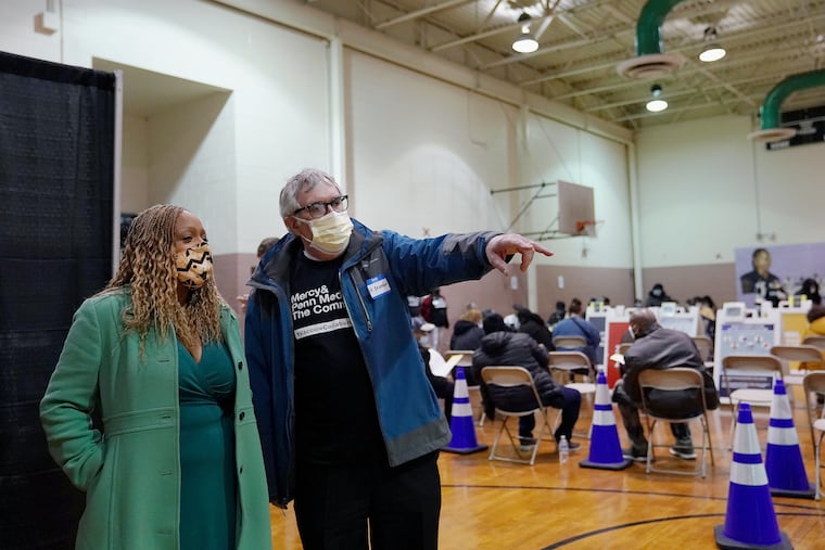 Penn Medicine Chief Medical Officer PJ Brennan (right) gives a tour to Third District City Councilmember Jamie Gauthier of a community COVID-19 vaccination clinic operated by Penn Medicine and Mercy Catholic Medical Center at the Francis J. Myers Recreation Center in Southwest Philadelphia on Saturday, Feb. 27, 2021.