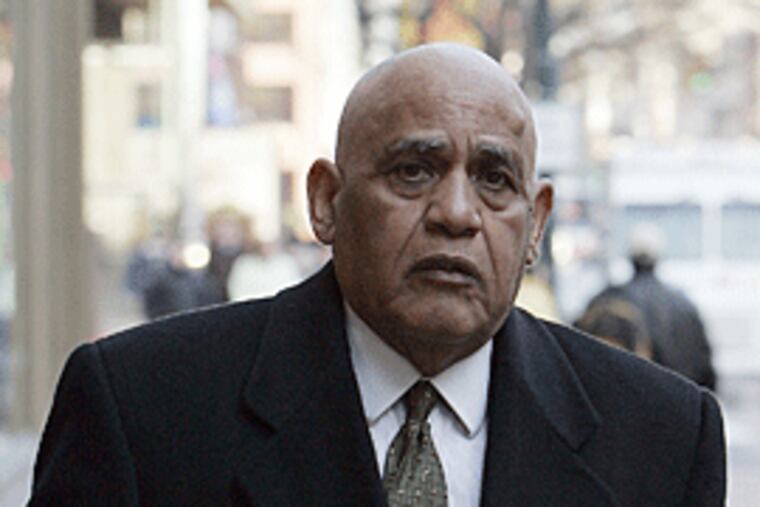 Milton Street leaves the federal courthouse today. The jury will resume its deliberations on Friday. (Michael Perez/ Inquirer )