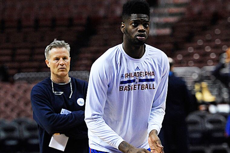 76ers head coach Brett Brown and center Nerlens Noel. (Michael Perez/AP)