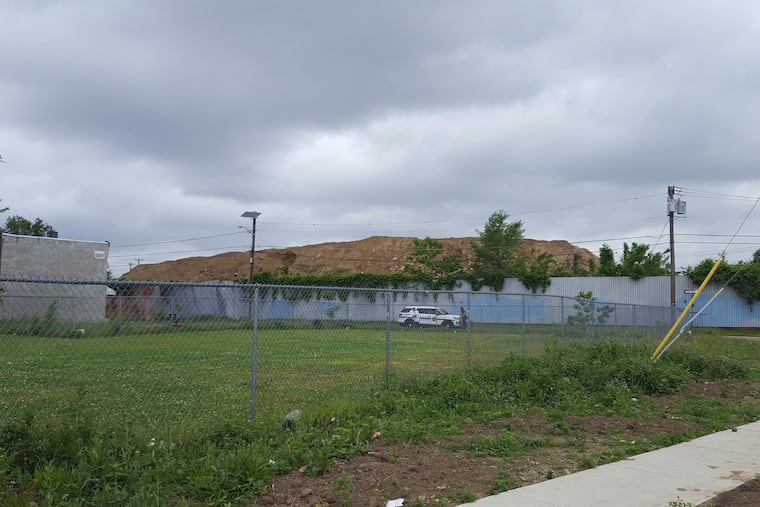 A view of Yaffa & Sons in Camden. State officials have asked a court to order an immediate cleanup of the illegal dump site in Camden that is comprised of contaminated waste several stories high and is “spreading onto neighboring properties, sidewalks, and roadways, threatening the safety and health of local residents and the environment.â€