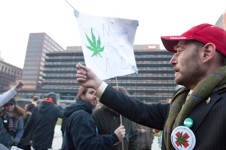 Chris Goldstein (right) at a 2012 "Smoke Down Prohibition" protest. Goldstein was arrested in 2013 while participating in a protest at Independence Mall, and received a federal marijuana possession charge as a result.