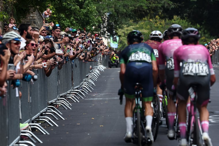 Cyclists climb the wall in Manayunk during the men’s race in the Philadelphia Cycling Classic Sunday.