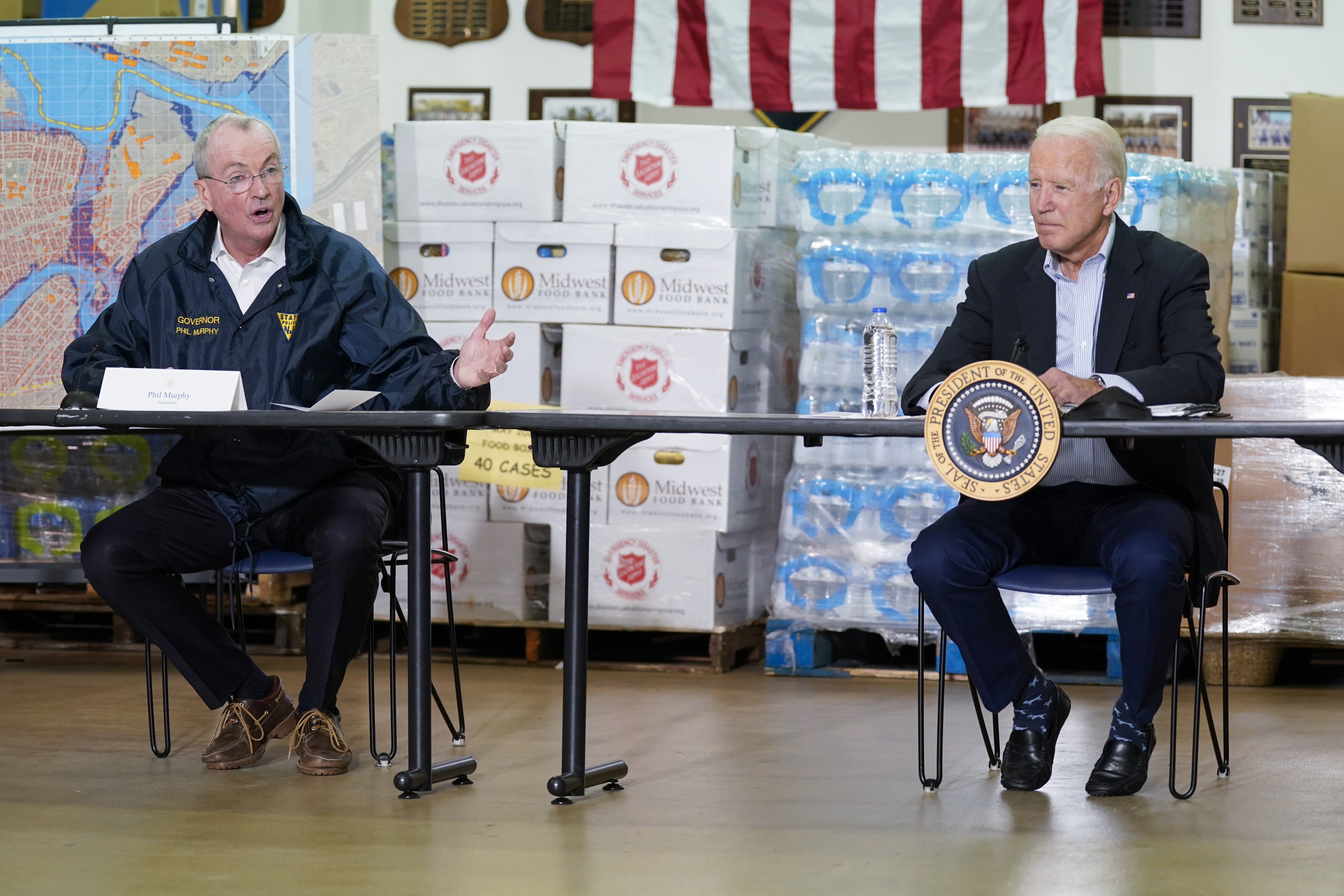 President Joe Biden listens as New Jersey Gov. Phil Murphy (left) speaks during a briefing about the impact of Hurricane Ida on Tuesday in Hillsborough Township, N.J.