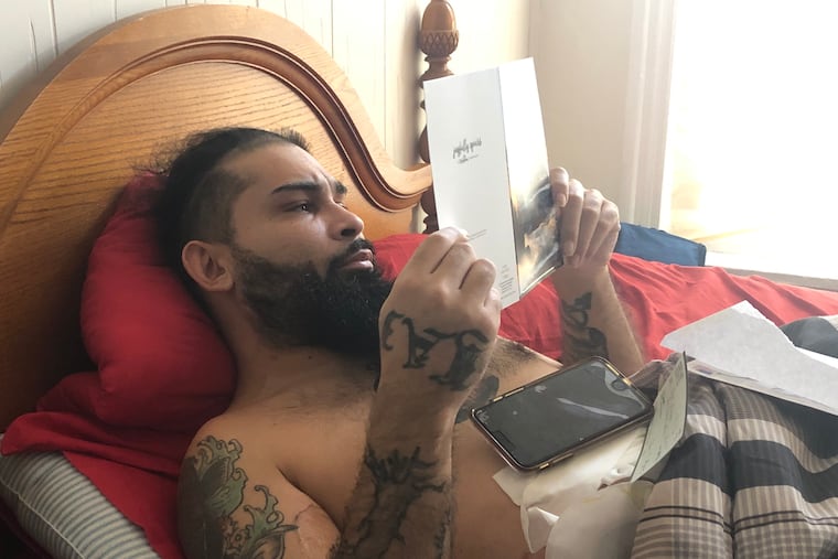 Luis Berrios was shot outside his Philadelphia home Nov. 12. While in the hospital, he wrote a letter forgiving the men who shot him. At home, he reads a card from a reader who was touched by his story.
